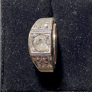 Men’s 10k cubic zirconia ring. Looks great with anything.